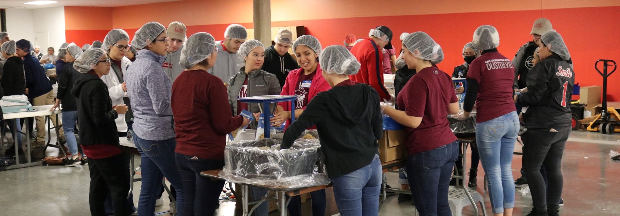 Feed My Starving Children Students and Hairnets 