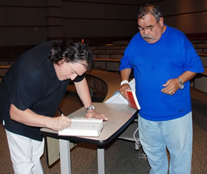 Dagoberto Gilb signing books