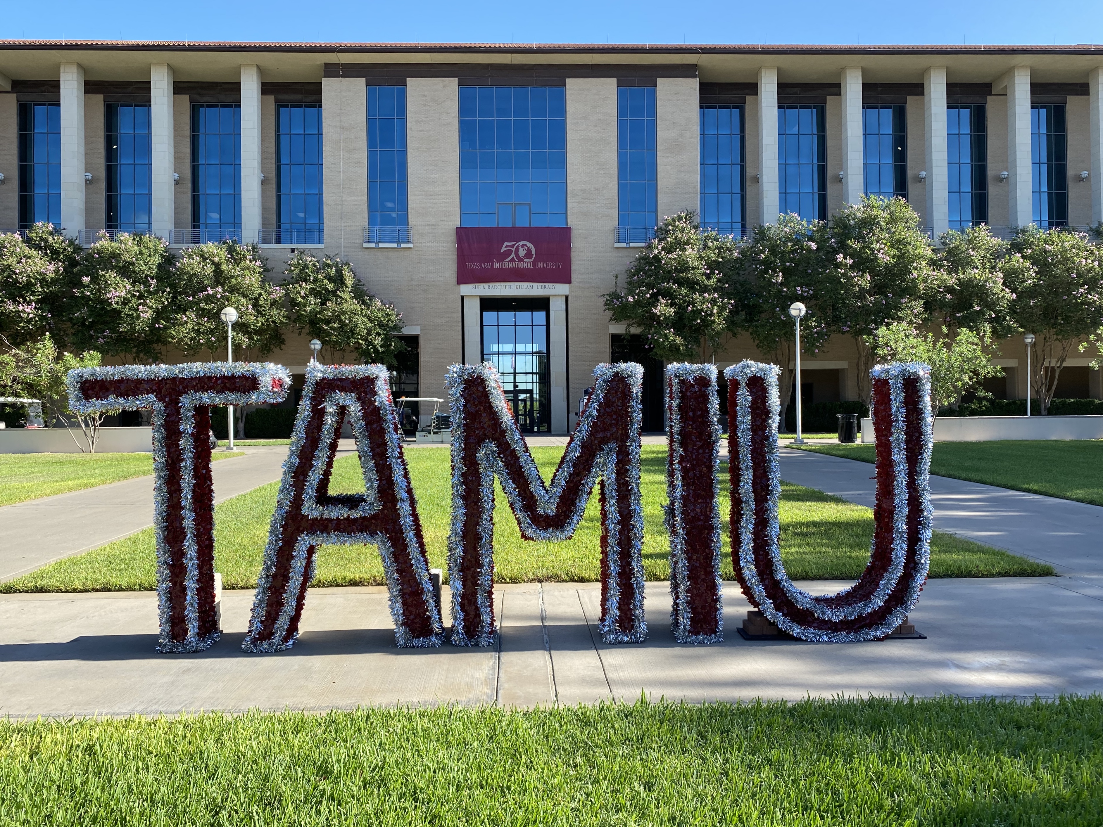 TAMIU glitter letters