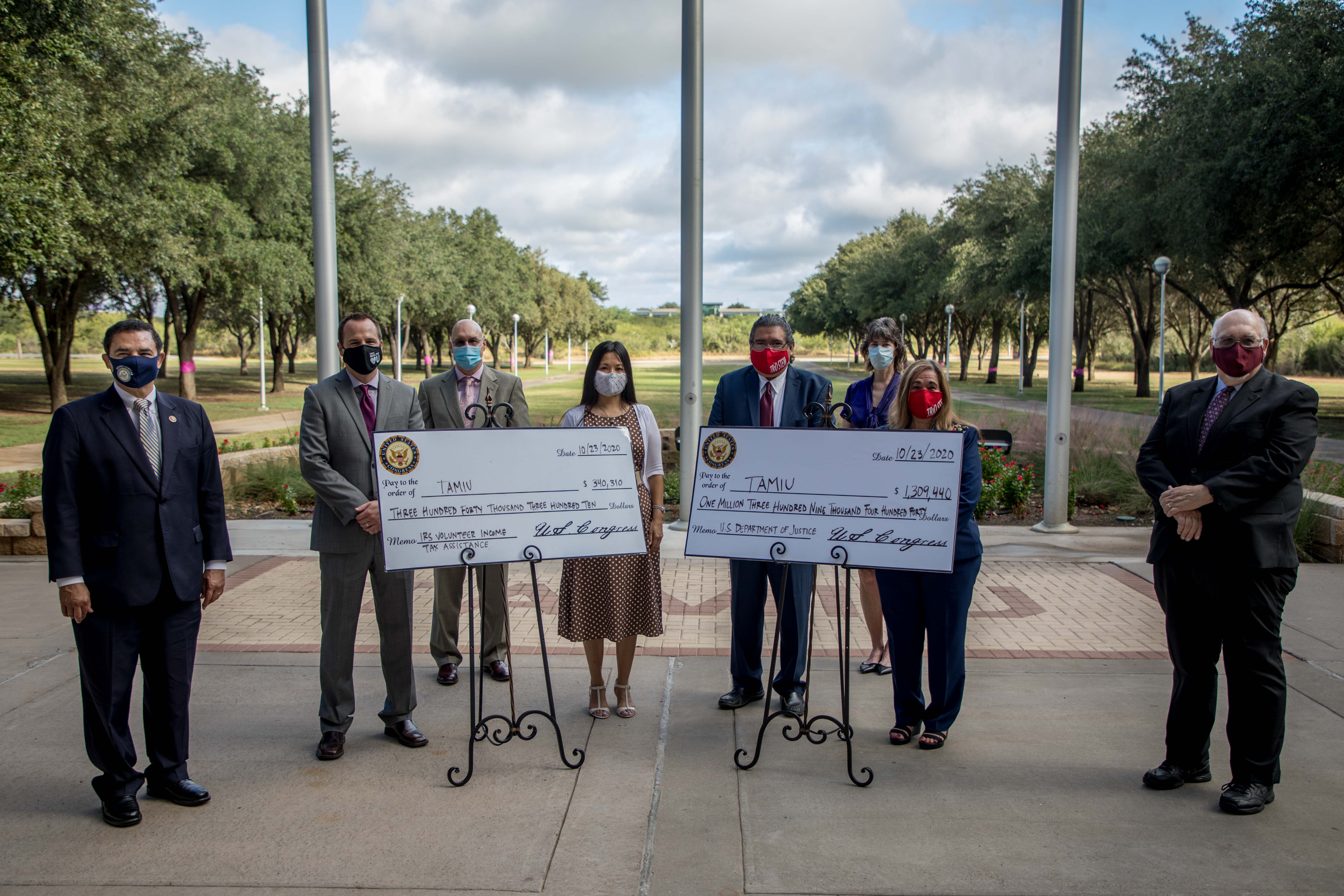 Federal funding announced at TAMIU will help support student services, as well as provide income tax assistance for Webb County residents. Pictured, from left to right, is: Congressman Rep. Henry Cuellar; Dr. Jack Byham, assistant professor of Political Science; Dr. John Kilburn, associate vice president for Research and Sponsored Projects; Dr. Barbara Hong, dean, University College; Dr. Gustavo Salazar, TRIO program director; Anne Frey, associate director of Grant Development; Leticia Cruz, director of Student Support Services; and Dr. Pablo Arenaz, University president. 
