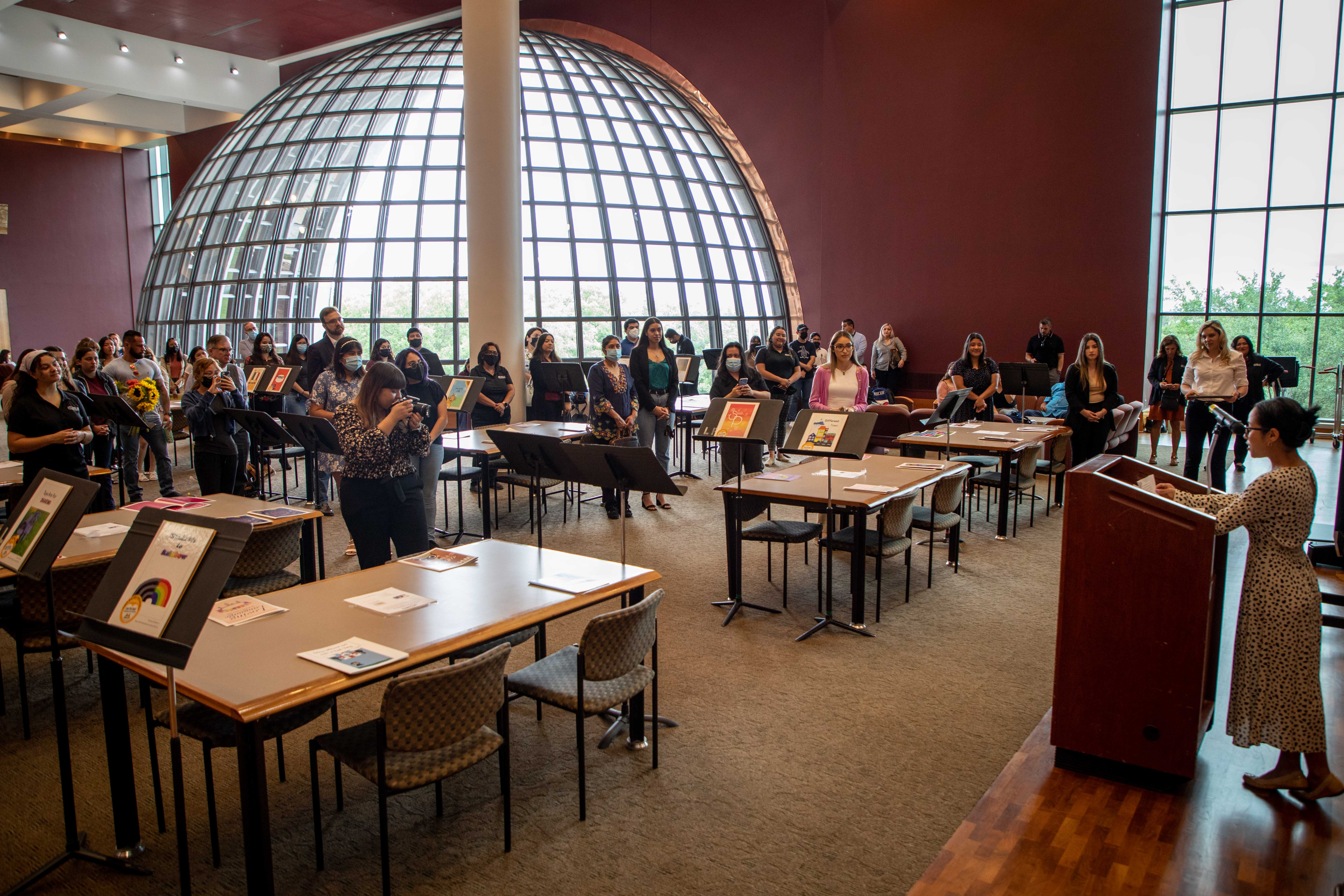 Student speaks to the crowd during the book handoff